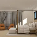 Dekorasi kamar tidur utama bergaya minimalis dengan pencahayaan hangat dan tanaman hias indoor